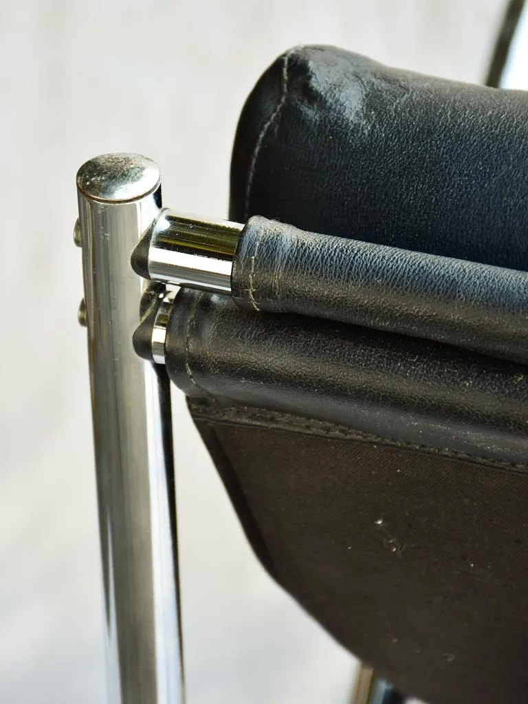 Pair of 1950's black leather and chrome armchairs in the style of Le Corbusier Charlotte Perriand