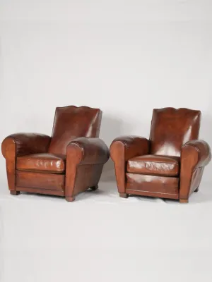 Pair of antique French leather club chairs - moustache back