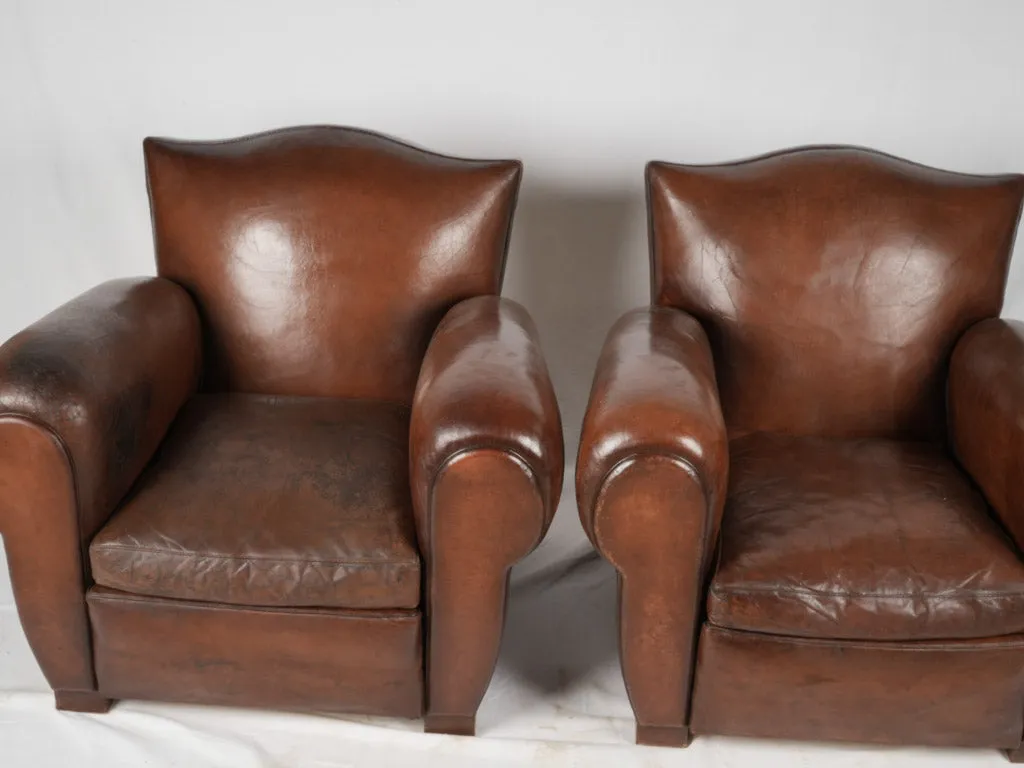 Pair of restored antique French leather club chairs