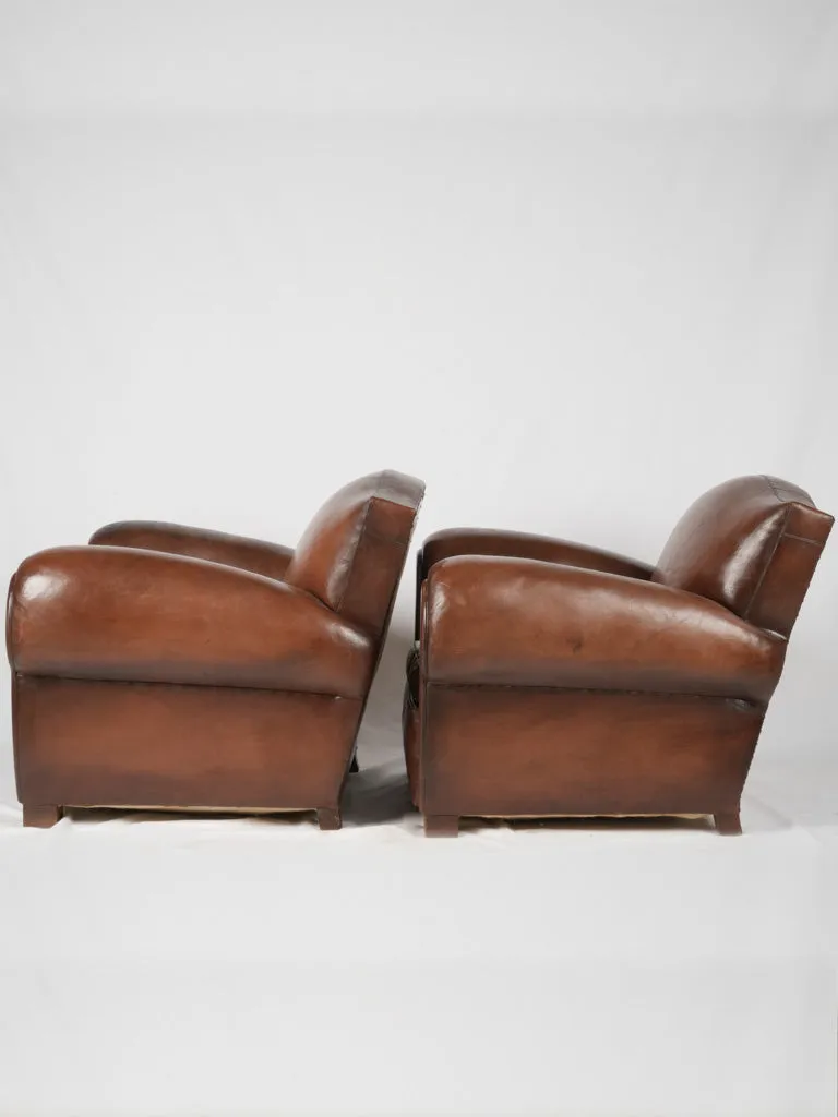 Pair of restored antique French leather club chairs