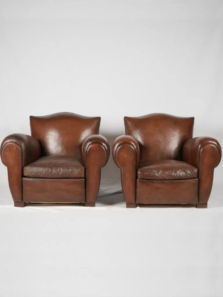 Pair of restored antique French leather club chairs