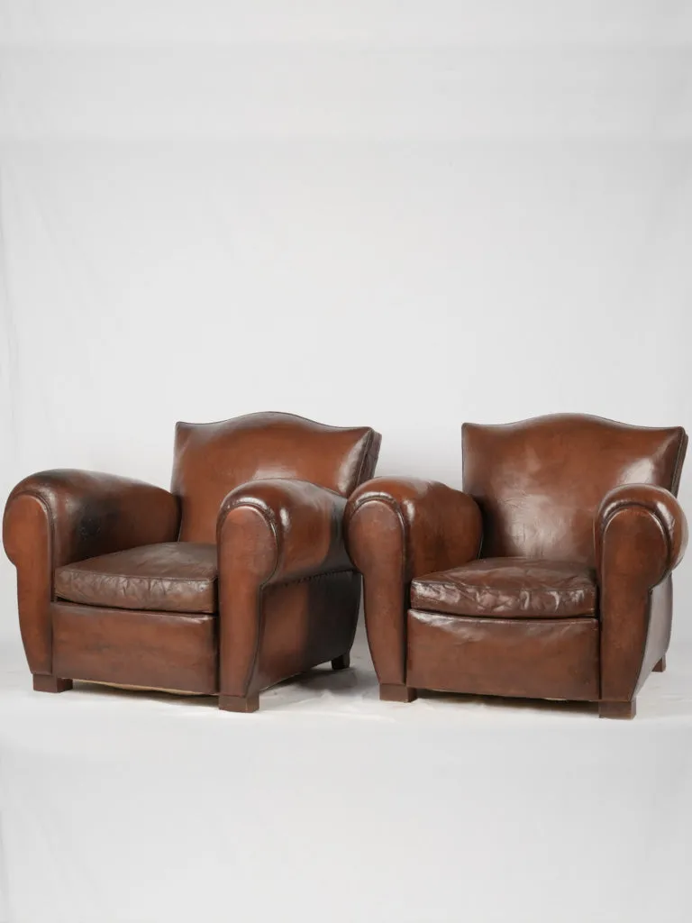 Pair of restored antique French leather club chairs