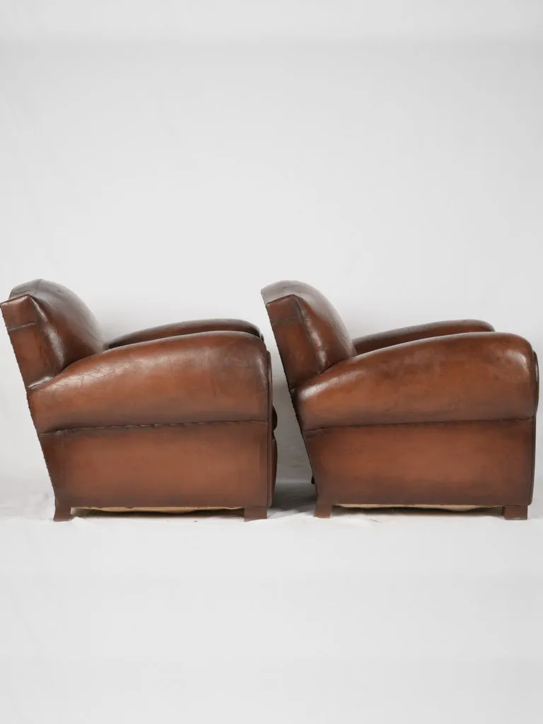 Pair of restored antique French leather club chairs